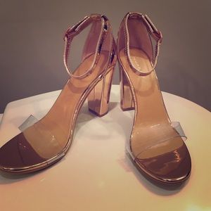 Rose gold chunky heeled sandals.